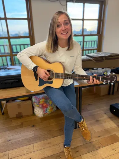 Steph with her acoustic guitar